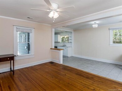 Living room opens to the kitchen.