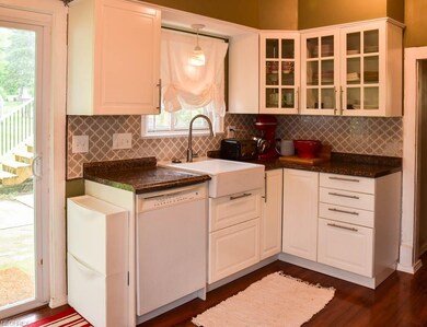 Updated kitchen with farmhouse sink and new backsp