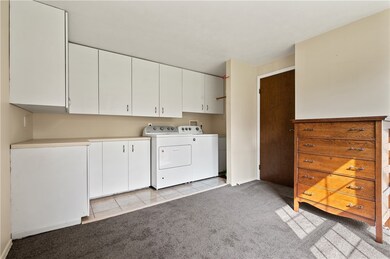 First floor large laundry room at entry