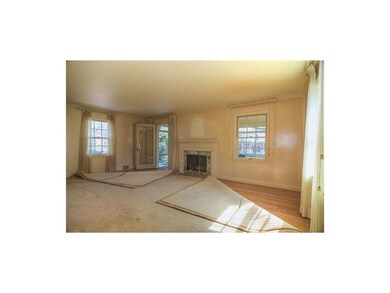 Living room opens to screened porch. Hardwoods loo
