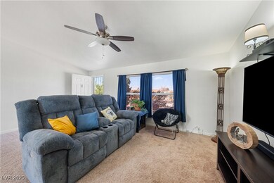 Carpeted living room with lofted ceiling, ceiling