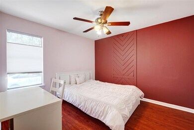 Bedroom featuring wood finished floors and a ceil