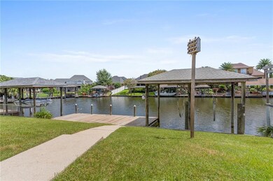 Backyard with boat dock for fishing and relaxing.  Boat house with hoist and a Purple Martin (bird) house.  Purple Martins are know to eat 1500 mosquitoes a night.