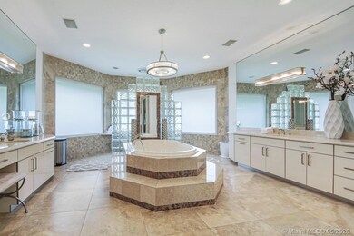 Master bathroom with separate sinks, large roman tub and separate walk-in shower