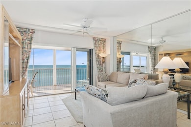 Tiled living room with a water view