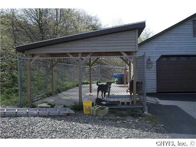 Exterior Back Dog area outside and it leads to the