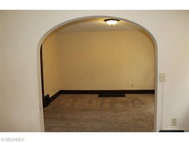 A formal dining room with fresh paint and newer ca