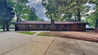 Ranch-style home with cooling unit, brick siding, 