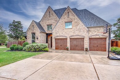 A triple-wide driveway leads to the 3-car attached garage, complete with automatic garage door openers, and 5' of extended space for ample parking and storage.