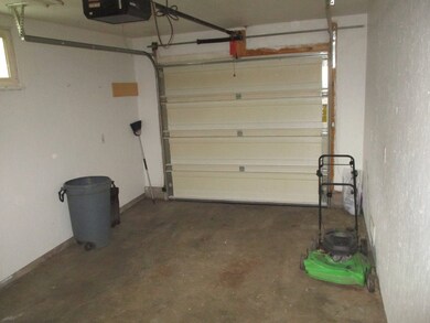 One car attached garage, fenced back yard and gard
