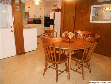 View from den to eating area and kitchen
