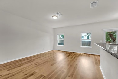 Spare room with light wood-style floors and baseb