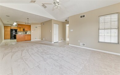 Open concept living, dining room with kitchen beyo