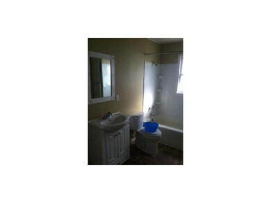 Full bathroom with new vinyl flooring.