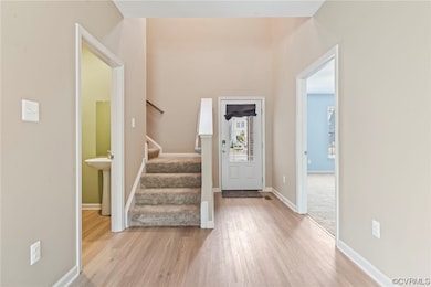 Entryway with primary bedroom to the right and hal