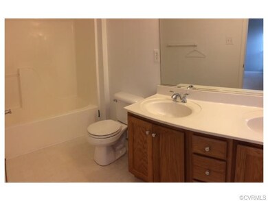 Master bath features updated faucets and double va