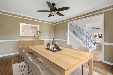Dining room featuring baseboards, wood finished fl