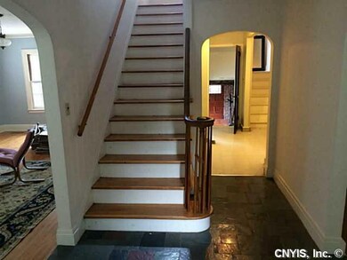 Foyer. Open foyer with curved archways, split stai
