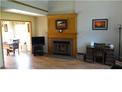 The living room features a window seat, gas firepl