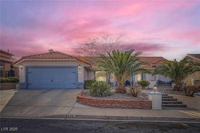 Mediterranean / spanish-style home with a garage,
