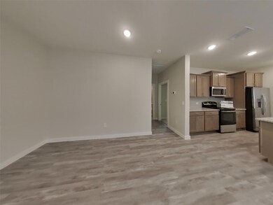 Kitchen featuring appliances with stainless steel