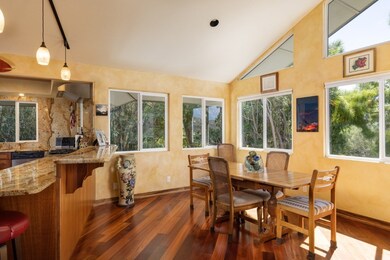 Multiple windows light up the kitchen and dining area.