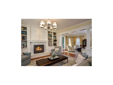 Beautiful Built-ins and marble surround gas firepl
