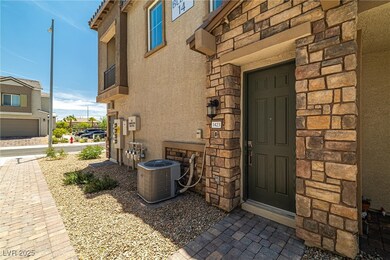 Property entrance with stucco siding and stone sid