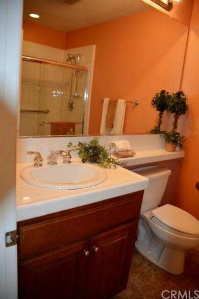 Downstairs bathroom next to bedroom.  Ceramic tile
