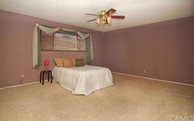 Spacious master suite with 2 closets including wal