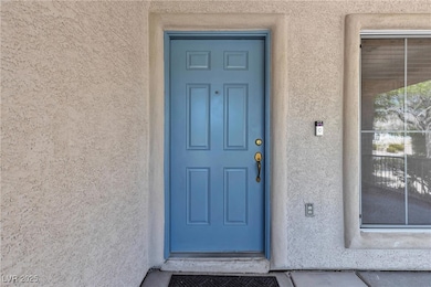 Property entrance with stucco siding
