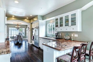 KITCHEN, EATING BAR AND DINING ROOM