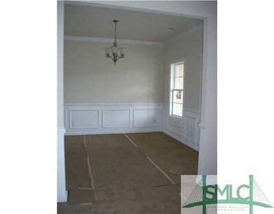 Dining Room. Dining room features crown molding, c
