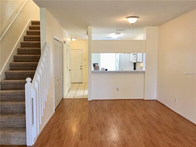 View looking towards front door and kitchen pass-t