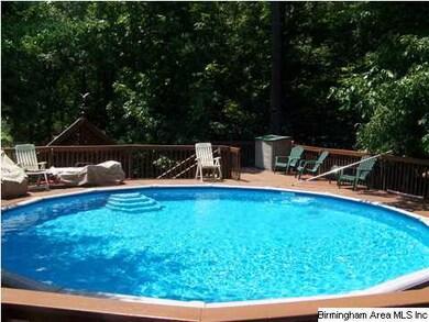 Circular pool w/ nice deck and fenced for safety.