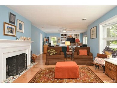 The living room is vast, measuring at 36 x 13 feet