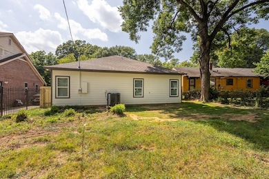Rear view of house with roof with shingles