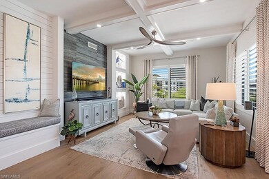 Living room with beamed ceiling, ceiling fan, coff
