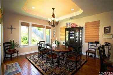 Sunny and inviting dining room with garden views.