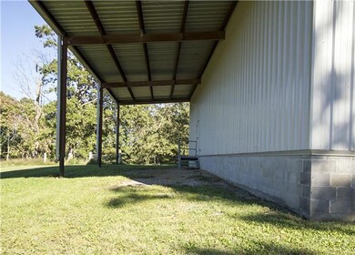 Implement Bay on the back of Shop perfect for getting equipment or animals out of the rain or great outside party facility.