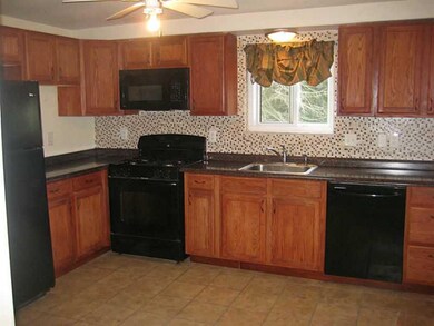 Kitchen. The updated kitchen offers newer cabinets