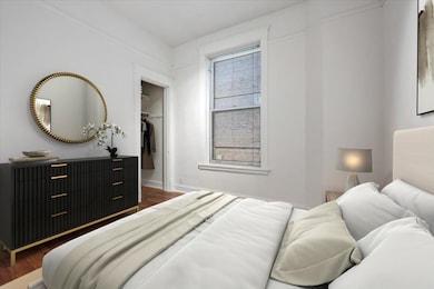 Front bedroom with a walk-in closet