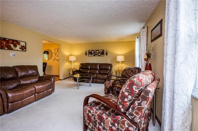 Neutral tones grace the walls of this large living