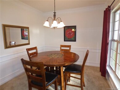 To the right of front door is the elegant dining r