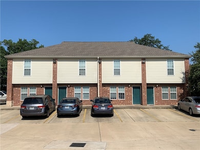 Townhome / multi-family property featuring uncover