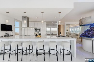 Designer kitchen Anchors the Main Living Area with Adjoining Living and Dining Spaces