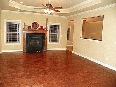 Living Room. Come home to Hand-scraped hardwood floors,Crown molding and beautiful finish work~