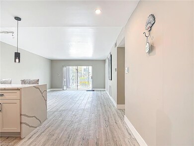 Unfurnished living room with light wood-style floo