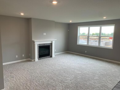 Beautiful windows provide ample natural light throughout the whole family room area. Model home.