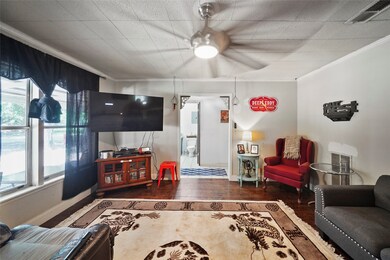 Another view of the living room looking to the front hallway.